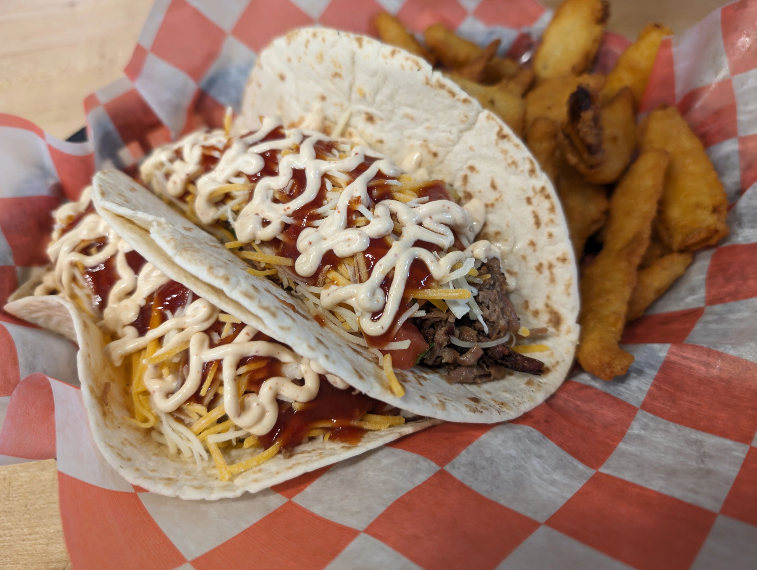 Pulled pork tacos with cheese and red sauce